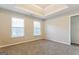 Well-lit bedroom with two windows and a closet at 7546 Petal Pl, Fairburn, GA 30213