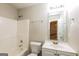 Clean bathroom with a tub, toilet, and vanity at 7546 Petal Pl, Fairburn, GA 30213