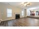 Living room with fireplace and laminate flooring at 7546 Petal Pl, Fairburn, GA 30213