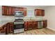 Kitchen with stainless steel appliances and granite countertops at 7546 Petal Pl, Fairburn, GA 30213