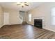 Spacious living room with fireplace and stairs at 7546 Petal Pl, Fairburn, GA 30213