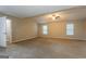Large main bedroom with carpet, ceiling fan and en-suite bathroom at 7546 Petal Pl, Fairburn, GA 30213