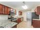 Modern kitchen boasts granite countertops and stainless steel appliances at 7546 Petal Pl, Fairburn, GA 30213