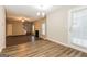 Open living room with hardwood floors, fireplace and access to backyard at 7546 Petal Pl, Fairburn, GA 30213