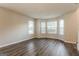 Bright living room with hardwood floors and bay windows at 7546 Petal Pl, Fairburn, GA 30213
