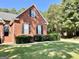 Brick house with landscaping and a walkway at 1307 Eddie Craig Ct, Mcdonough, GA 30252