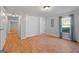 Bright bedroom with wood flooring, double doors to closet, and window with curtains at 465 Haynie Rd, Moreland, GA 30259
