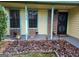 Inviting front porch with brick columns and entrance at 6722 Bent Creek Dr, Rex, GA 30273
