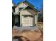 Attached garage with overhead door and ample space for parking and storage at 6722 Bent Creek Dr, Rex, GA 30273