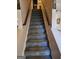 Carpeted staircase leading to upper level at 6722 Bent Creek Dr, Rex, GA 30273