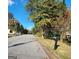 Quiet residential street with mature trees and houses at 6722 Bent Creek Dr, Rex, GA 30273
