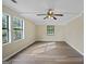 Large bedroom with hardwood floors and two windows at 108 Adrian Dr, Stockbridge, GA 30281