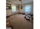 Spacious bedroom with large windows, built-in shelving and carpet at 1500 Pine Forest Rd, Mansfield, GA 30055