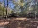 Two covered storage sheds in a wooded area at 1500 Pine Forest Rd, Mansfield, GA 30055