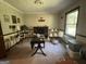Living room with hardwood floors, large windows and fireplace at 1500 Pine Forest Rd, Mansfield, GA 30055