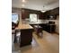 Spacious kitchen featuring ample cabinetry and a large island at 1500 Pine Forest Rd, Mansfield, GA 30055