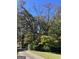 Long driveway leading to home, lined with trees at 1500 Pine Forest Rd, Mansfield, GA 30055
