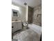 Clean bathroom with a tub, tile flooring and vanity at 1500 Pine Forest Rd, Mansfield, GA 30055