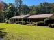 Brick ranch home with mature trees and a large lawn at 1500 Pine Forest Rd, Mansfield, GA 30055