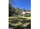 Spacious backyard with large lawn area and trees at 1500 Pine Forest Rd, Mansfield, GA 30055