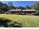 Brick ranch home with large yard and mature trees at 1500 Pine Forest Rd, Mansfield, GA 30055