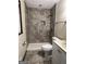 Updated bathroom with a tile shower and vanity at 1500 Pine Forest Rd, Mansfield, GA 30055