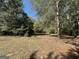 Open yard space, partially shaded with trees at 1500 Pine Forest Rd, Mansfield, GA 30055
