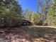Covered parking for vehicles, nestled in woods at 1500 Pine Forest Rd, Mansfield, GA 30055