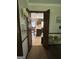 View of kitchen from hallway, offering a glimpse into the space at 1500 Pine Forest Rd, Mansfield, GA 30055