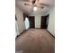 Spacious bedroom with ceiling fan and ample closet space at 1500 Pine Forest Rd, Mansfield, GA 30055