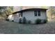 Rear view of the house exterior showing the AC unit and landscaping at 5605 Bethlehem Rd, Fairburn, GA 30213