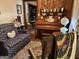 Living room features a piano and wood paneled walls at 5605 Bethlehem Rd, Fairburn, GA 30213