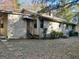 Side view of the house exterior showing the steps and landscaping at 5605 Bethlehem Rd, Fairburn, GA 30213