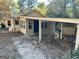 Front view of a house with a carport and landscaping at 5605 Bethlehem Rd, Fairburn, GA 30213