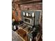 Brick fireplace with wood stove and decorative accessories at 5605 Bethlehem Rd, Fairburn, GA 30213
