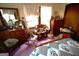 Cozy bedroom with two windows, dresser, and a bed at 5605 Bethlehem Rd, Fairburn, GA 30213