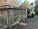 Rear view of a house with a wooden lattice covered patio at 5605 Bethlehem Rd, Fairburn, GA 30213