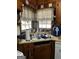 Corner kitchen sink with wood cabinets at 5605 Bethlehem Rd, Fairburn, GA 30213