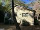 Side view of the house exterior, showing the satellite dish and landscaping at 5605 Bethlehem Rd, Fairburn, GA 30213