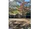 House exterior showcasing fall foliage and a covered patio at 5605 Bethlehem Rd, Fairburn, GA 30213