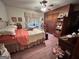 Bright bedroom with double bed, built-in wooden closet and bookcase at 5605 Bethlehem Rd, Fairburn, GA 30213