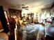 Another view of the dining room with wooden table, chairs and built-in shelving at 5605 Bethlehem Rd, Fairburn, GA 30213