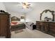 Spacious bedroom with a large bed, dresser, and window with curtains at 326 Cog Hill Dr, Fairburn, GA 30213