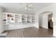 Spacious room featuring built-in shelving and hardwood floors at 326 Cog Hill Dr, Fairburn, GA 30213