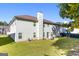 Two story house with backyard and grassy lawn at 326 Cog Hill Dr, Fairburn, GA 30213