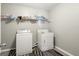 Laundry room with washer, dryer, and shelving for storage at 326 Cog Hill Dr, Fairburn, GA 30213