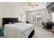 Bedroom with a queen bed, desk, and view of the neighborhood at 326 Cog Hill Dr, Fairburn, GA 30213