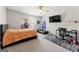 Bright bedroom featuring a bed, desk, and wall-mounted TV at 326 Cog Hill Dr, Fairburn, GA 30213