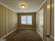 Simple bedroom with neutral walls, carpeting and two windows at 1764 Thomas Ter, Decatur, GA 30032