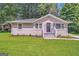 Updated Ranch home with landscaped lawn and front steps at 1764 Thomas Ter, Decatur, GA 30032
